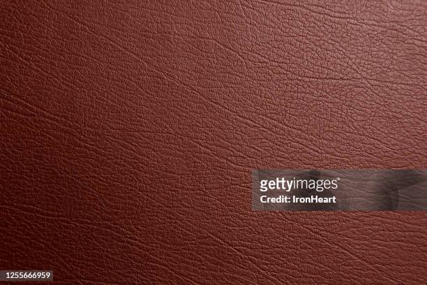 brown genuine text and background of leather - materiale di pelle animale foto e immagini stock