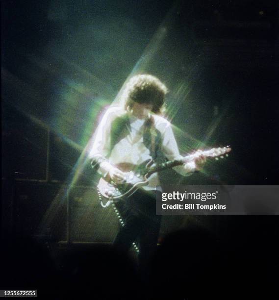 July 1982]: MANDATORY CREDIT Bill Tompkins/Getty Images Brian May of Queen perform at Madison Square Garden July 1982 in New York City.
