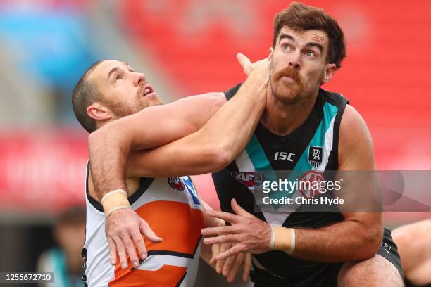 Shane Mumford of the Giants and Scott Lycett of the Power compete for the ball during the round 6 AFL match between the Port Adelaide Power and the...