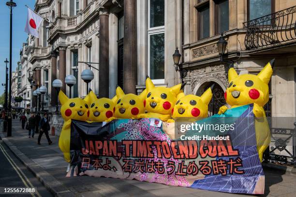 In this handout provided by No Coal Japan Coalition, protesters from No Coal Japan Coalition dress as Pokemon character Pikachu as they demonstrate...