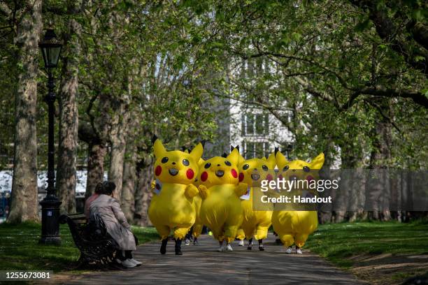 In this handout provided by No Coal Japan Coalition, protesters from No Coal Japan Coalition dress as Pokemon character Pikachu as they demonstrate...