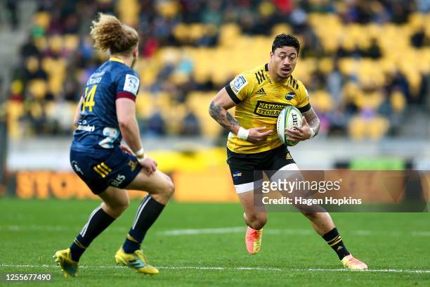 Ben Lam of the Hurricanes attempts to evade Scott Gregory of the Highlanders during the round 5 Super Rugby Aotearoa match between the Hurricanes and...