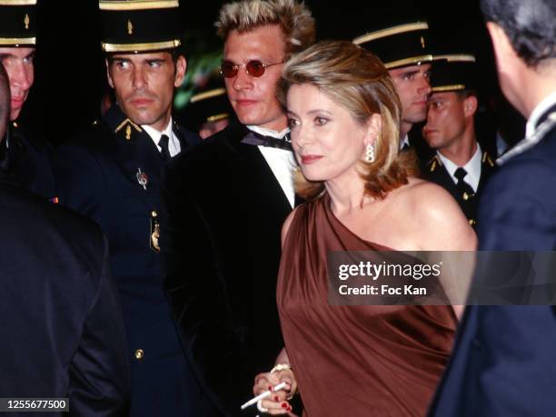 Guillaume Depardieu and Catherine Deneuve attends the 52th Cannes Film Festival on May 1999 in Cannes, France.