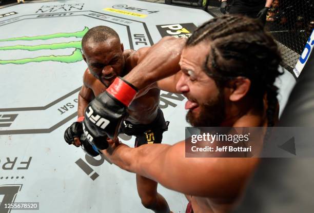 Kamaru Usman of Nigeria elbows Jorge Masvidal in their UFC welterweight championship fight during the UFC 251 event at Flash Forum on UFC Fight...