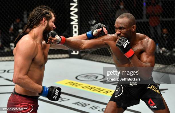 Kamaru Usman of Nigeria punches Jorge Masvidal in their UFC welterweight championship fight during the UFC 251 event at Flash Forum on UFC Fight...