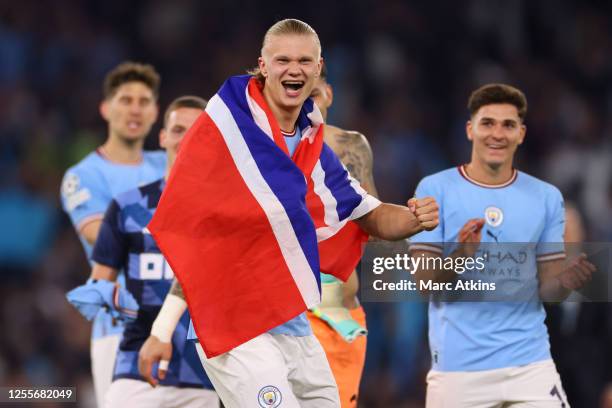 Erling Haaland of Manchester City celebrates draped in the Norwegian flag during the UEFA Champions League semi-final second leg match between...
