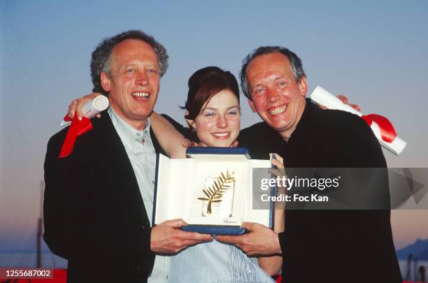 Awarded Directors Jean-Pierre Dardenne, Luc Dardenne and awarded actress Emilie Dequenne attend the 52th Cannes Film Festival on May 1999 in Cannes,...