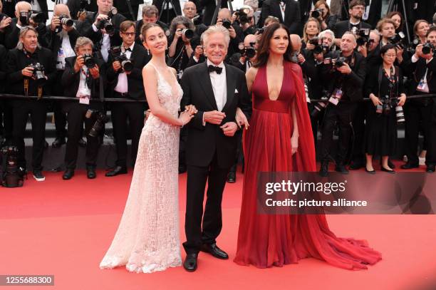 May 2023, France, Cannes: Catherine Zeta-Jones, Michael Douglas and daughter Carys Zeta Douglas arrive at the opening night film "Jeanne du Barry" of...