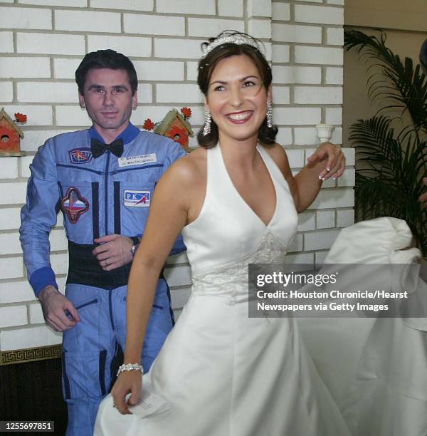 Ekaterina Dmitriev the bride of Russian cosmonaut Yuri Malenchenko with a life size cut out of her new husband at a press conference in Seabrook,...