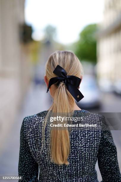 Lexi Fargo wears a Maison Michel hair bow / ribbon, a Chanel green and white tweed jacket, on July 11, 2020 in Paris, France.