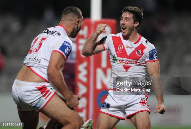 Ben Hunt of the Dragons celebrates after Josh Kerr of the Dragons scored a try during the round nine NRL match between the St George Illawarra...