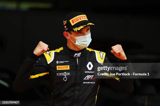 Race winner Christian Lundgaard of Denmark and ART Grand Prix celebrates on the podium during the sprint race for the Formula 2 Championship at Red...