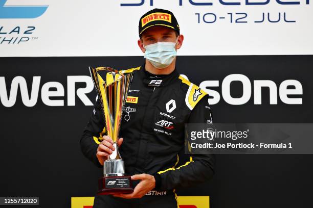 Race winner Christian Lundgaard of Denmark and ART Grand Prix celebrates on the podium during the sprint race for the Formula 2 Championship at Red...