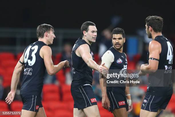 Mitch McGovern of the Blues celebrates a goal during the round 6 AFL match between the Carlton Blues and the Western Bulldogs at Metricon Stadium on...