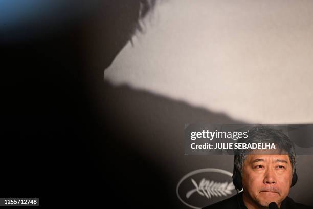 Japanese director Kore-Eda Hirokazu attends a press conference for the film "Kaibutsu" during the 76th edition of the Cannes Film Festival in Cannes,...