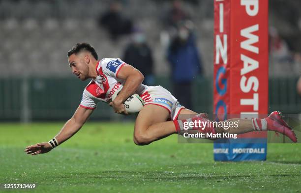 Corey Norman of the Dragons scores a try during the round nine NRL match between the St George Illawarra Dragons and the Manly Sea Eagles at...