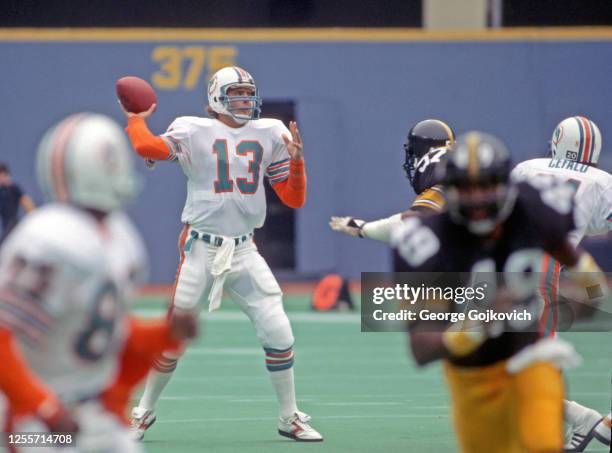 Quarterback Dan Marino of the Miami Dolphins passes against the Pittsburgh Steelers during a game at Three Rivers Stadium on October 7, 1984 in...