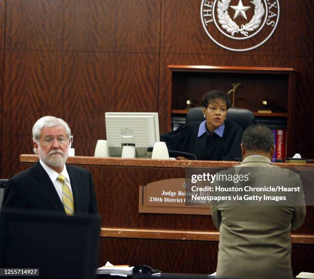 Andrea Yates attorney George Parnham looks back at the courtroom as Judge Belinda Hill speaks with Harris County Prosecutor Joe Owmby in the 230th...