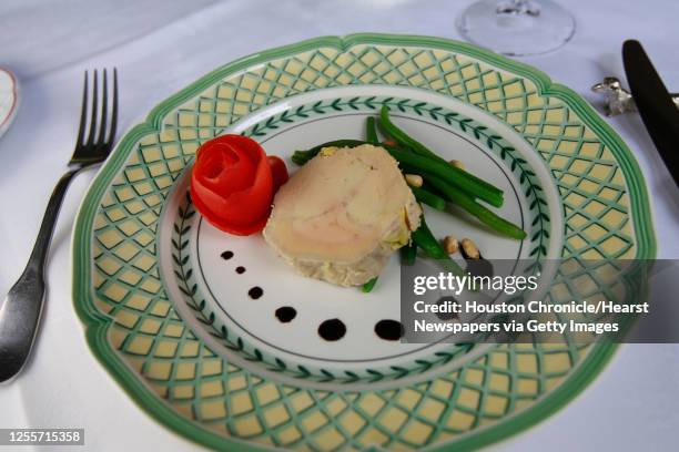 The "Terrine de Foie Gras" with tiny green beans, balsamic vinegar reduction and pine nuts at Chez Georges restaurant in Houston, Texas July 27,2006....