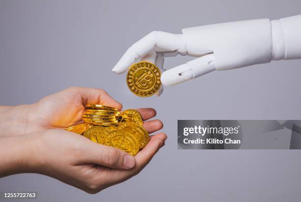 Robtic R Mony Robot Holding Money Photos and Premium High Res Pictures - Getty Images