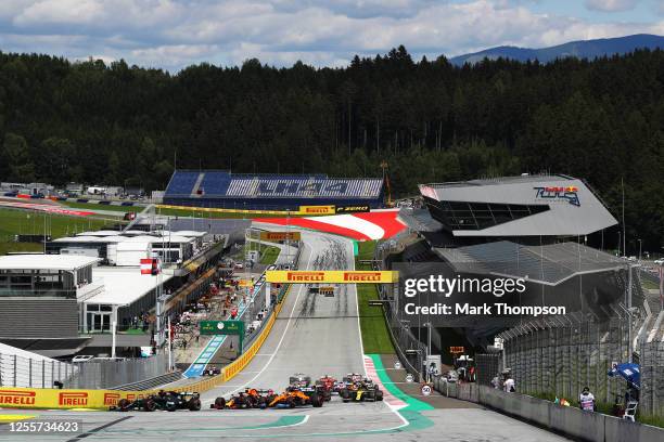 General view as Lewis Hamilton of Great Britain driving the Mercedes AMG Petronas F1 Team Mercedes W11 leads the field into the first corner during...