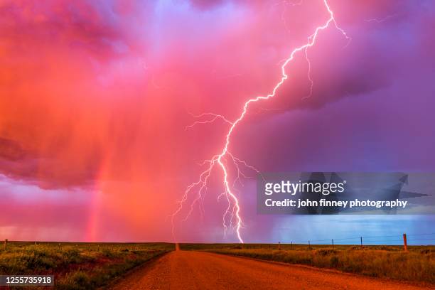 monsoon sunset lightning with a rainbow - greeley colorado stockfoto's en -beelden