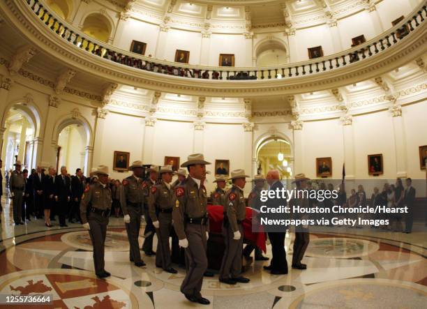 Texas Department of Public Safety officers wheel in the casket of former Governor Ann Rchards during a memorial ceremony for former Texas Governor...