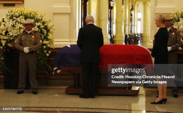 Former U.S. President Bill Clinton stands over the casket of former Texas State Governor Ann Richards while her daughter Cecile Richards (2nd from...