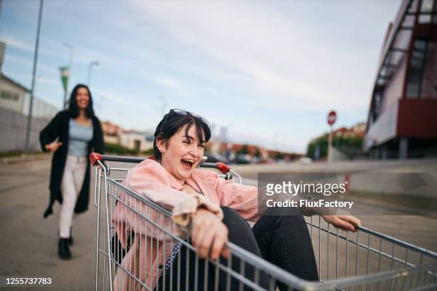 parkplatz spaß - girl after shopping stock-fotos und bilder