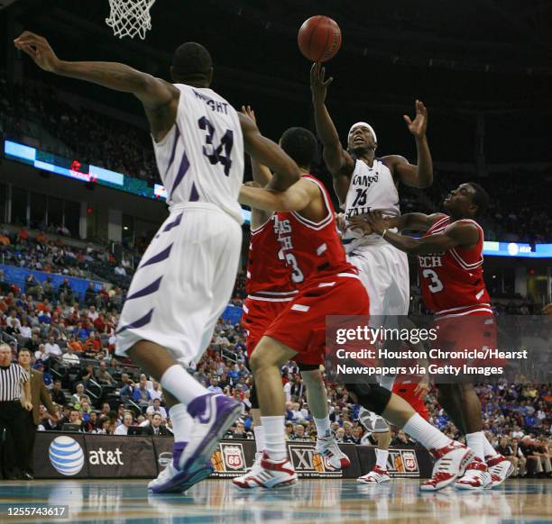 Kansas State's David Hoskins jumps for the ball during the second half of Phillips 66 Big 12 Men's Basketball Championship quarterfinal game against...