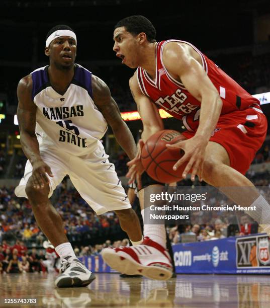 Texas Tech's Decensae White dribbles the ball past Kansas State's David Hoskins during the first half of Phillips 66 Big 12 Men's Basketball...