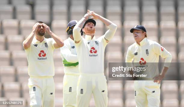 Mark Wood Ben Stokes and Ollie Pope of England react after losing their review during day five of the 1st #RaiseTheBat Test match at The Ageas Bowl...