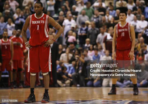 The Houston Rockets Tracy McGrady and Yao Ming stand on the court near the end of the fourth quarter of game six in the first round of the NBA...