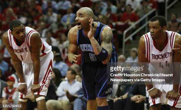 Houston Rockets guard Tracy McGrady, left, walks back to the bench News  Photo - Getty Images