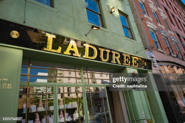 laduree sign and entrance in new york city - laduree stock pictures, royalty-free photos & images