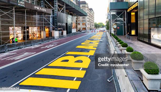 mayor deblasio has black lives matter painted in front of trump towers on 5th avenue in manhattan, nyc - black lives matter stock pictures, royalty-free photos & images