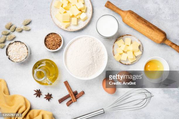 baking ingredients on white concrete background - postres lacteos fotografías e imágenes de stock