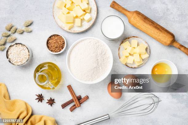 baking ingredients on white concrete background - blue bowl foto e immagini stock