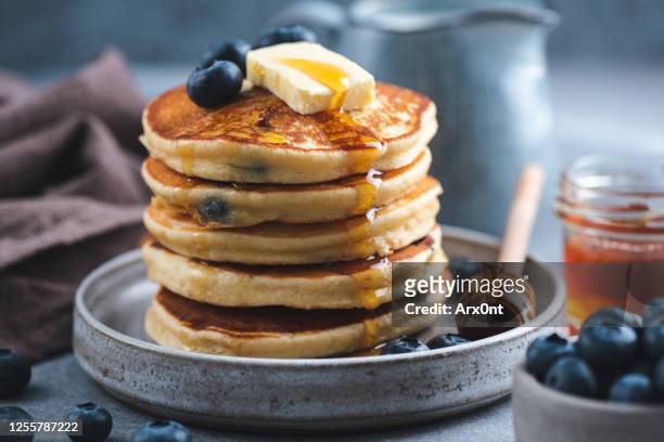 blueberry pancakes with honey and butter - american pancakes stock pictures, royalty-free photos & images