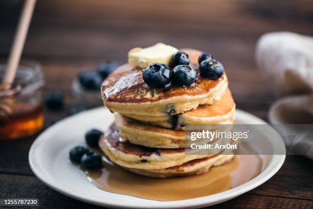 tasty blueberry pancakes with syrup - pancake breakfast stock pictures, royalty-free photos & images