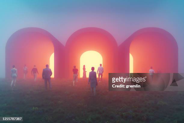 people walking towards mysterious tunnels - spirituality stock pictures, royalty-free photos & images