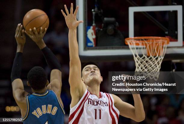 The Houston Rockets Yao Ming is unable to stop the Washington Wizards Nick Young during the third quarter of NBA game action at the Toyota Center...