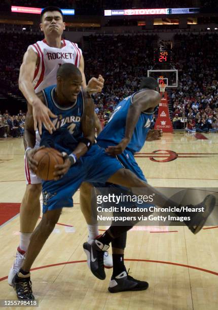 The Houston Rockets Yao Ming comes up short on a rebound to the Washington Wizards Antwan Jamison during the third quarter of NBA game action at the...