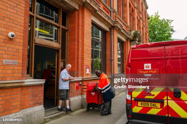 Postal workers outside a Royal Mail delivery office in London, UK, on Thursday, May 18, 2023. International Distributions Services Plc, which owns...