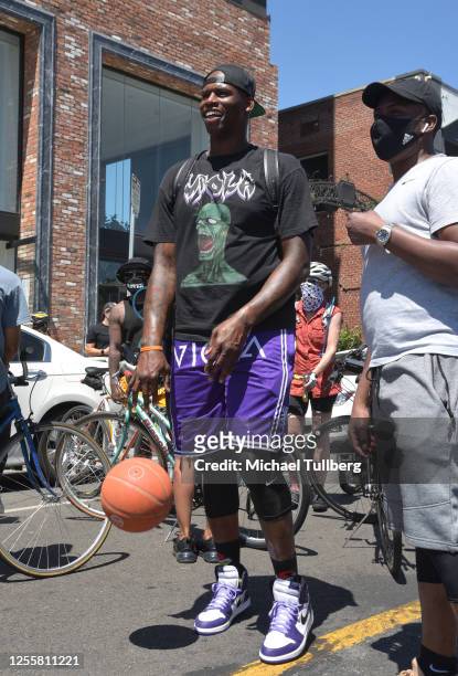 Former NBA player and entrepreneur Al Harrington shoots hoops at a Black Lives Matter bicycle rally on July 12, 2020 in Los Angeles, California....
