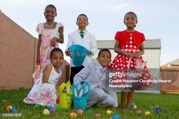 Javan Tate , Alisha Tate , Joshua Tate , Aaron Tate and Lauren Tate pose for an easter fashion shoot Monday, April 6 in Pearland.