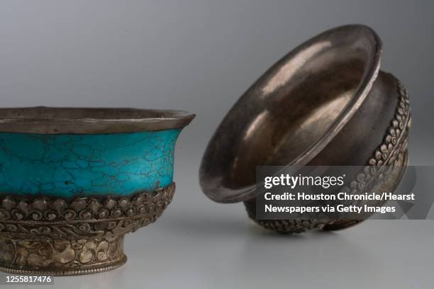 Turquoise and silver Tibetan prayer bowl, $400, and Wood and silver Tibetan prayer bowl, $400, from Tessera photographed in the Houston Chronicle...