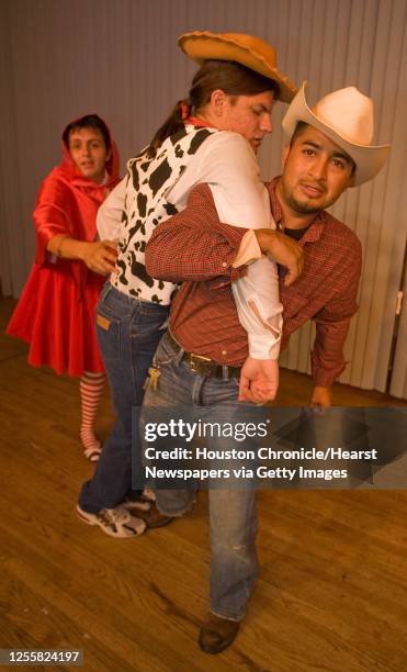 Ignacio Covarrubis as "Lumber Jack", Diego Olalla as "Woody", Eddie Gonzalez as "Little Red Riding Hood", during theatre Teatro Indigo's production...