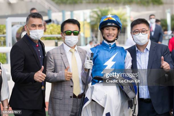 Jockey Jerry Chau Chun-lok and trainer Ricky Yiu Poon-fai celebrate after Super Oasis winning the Race 9 Hong Kong Racehorse Owners Association...