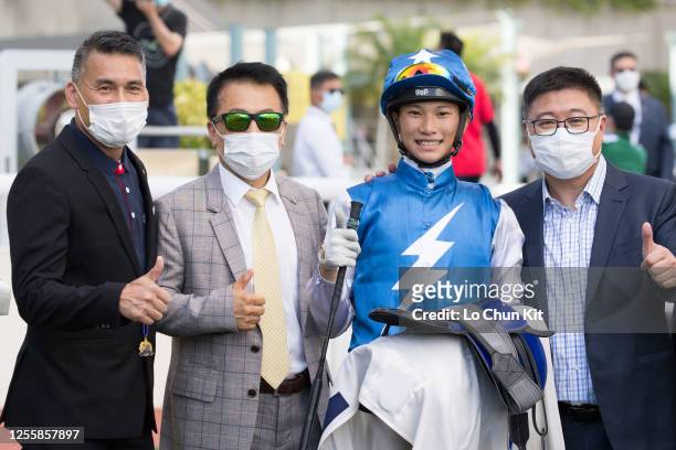 Jockey Jerry Chau Chun-lok and trainer Ricky Yiu Poon-fai celebrate after Super Oasis winning the Race 9 Hong Kong Racehorse Owners Association...